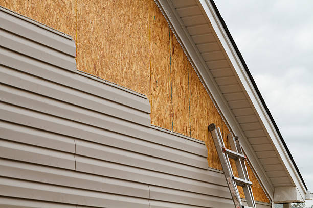 Professional Siding Replacement technician working in Hurlock, MD